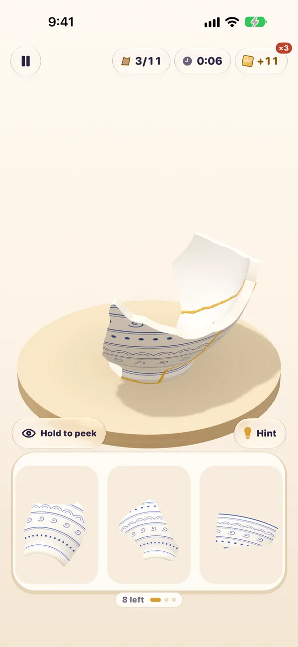 A mend in progress: a broken bowl above a tray of shards.